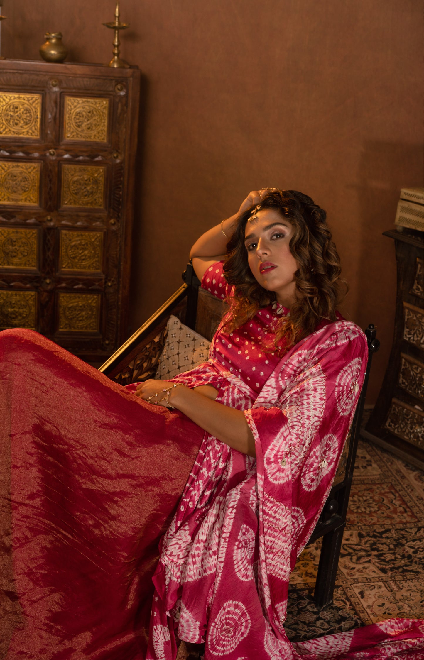 Shibori blouse styled with organza tissue bias skirt and embroidered dupatta. Additional Suspender peplum can be styled inside or outside the blouse