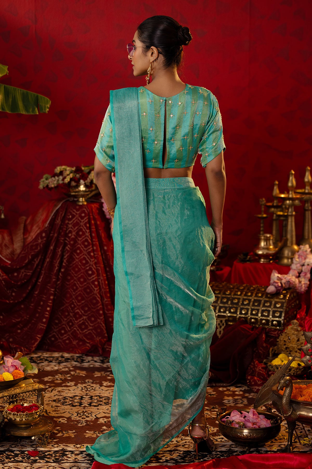 
                  
                    Turquoise Tissue Saree Set
                  
                