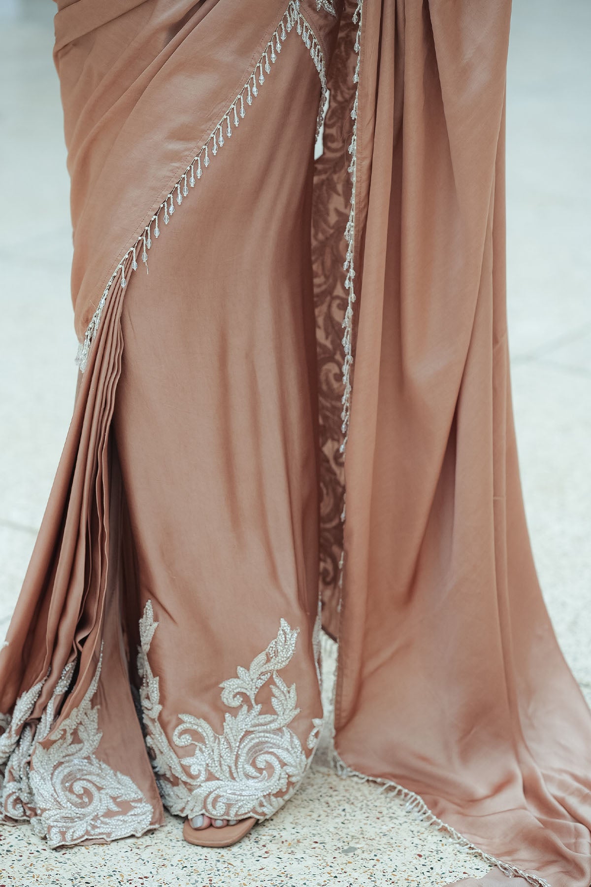 
                  
                    Nude Satin Beaded Border Split Saree
                  
                