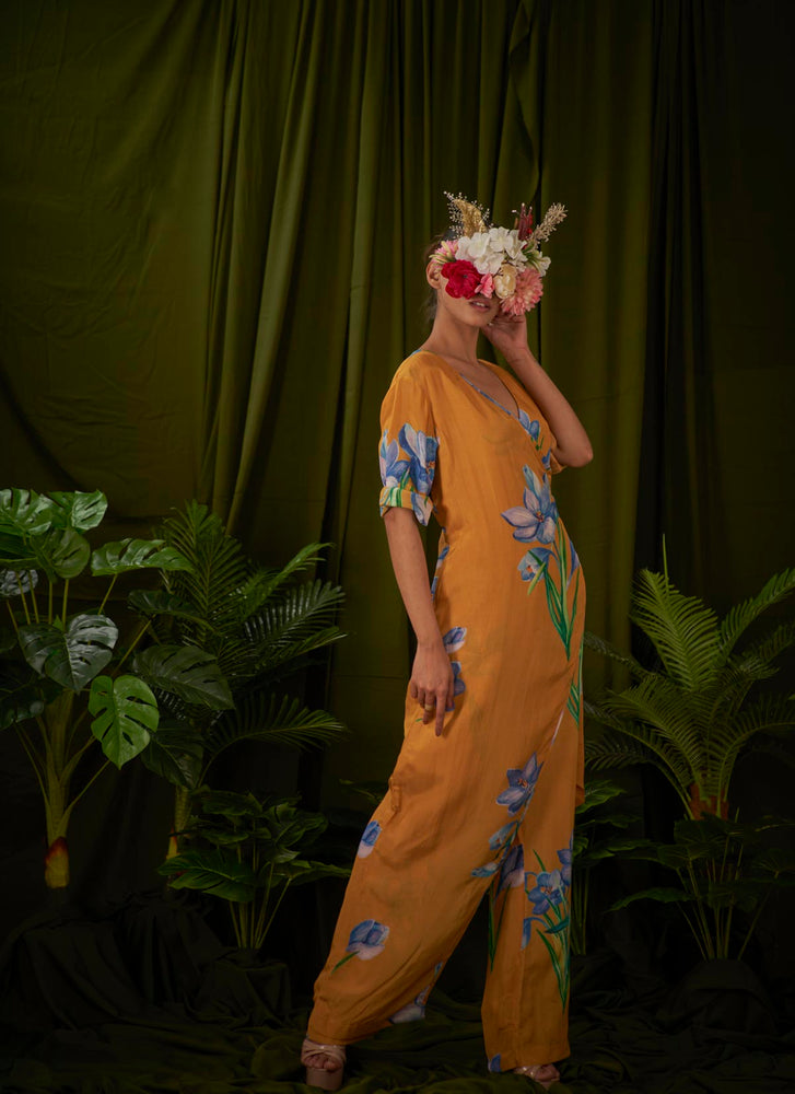 
                  
                    Wildsaffron Flower Overlay Jumpsuit.
                  
                