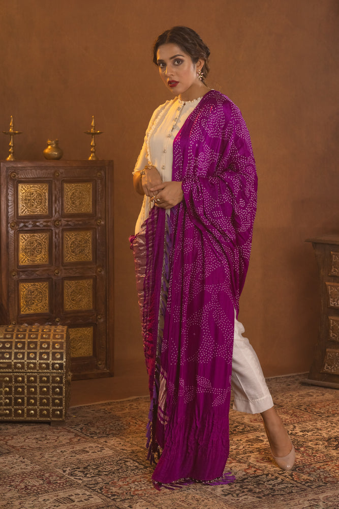 
                  
                    Gather detailed tunic styled with straight pants and bandhani dupatta
                  
                