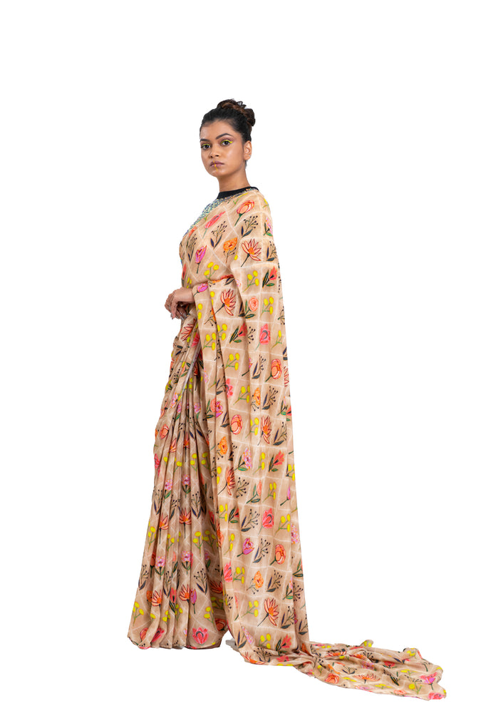 
                  
                    Checkered Floral Print Saree Styled With Holographic Sequin Blouse
                  
                